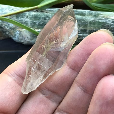 Lemurian seed crystal point pendant size slightly smoky