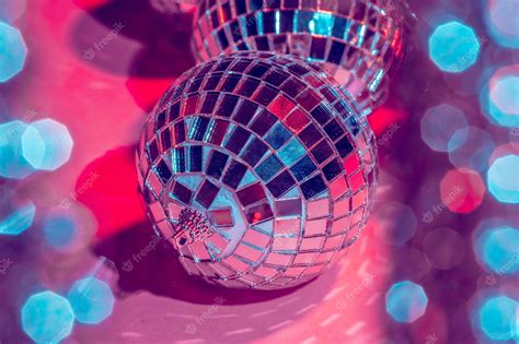 Premium Photo | Mirror disco balls over pink . party, nightlife