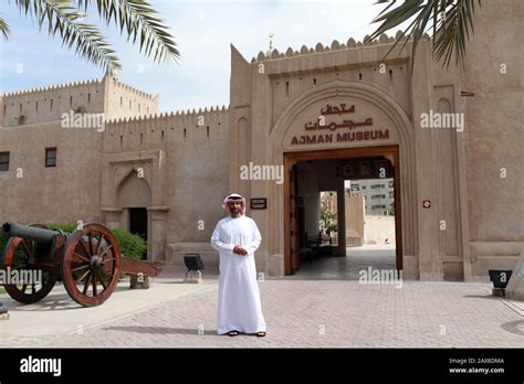 A man stands in front of the Ajman Museum. Ajman, UAE Stock Photo - Alamy