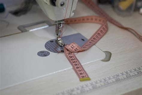 Premium Photo | Detail of sewing machine and sewing accessories