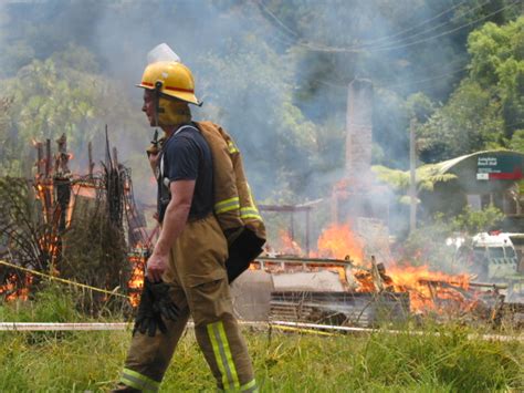 A Fireman In Front Of Burnt House | A Fireman In Front Of Bu… | Flickr