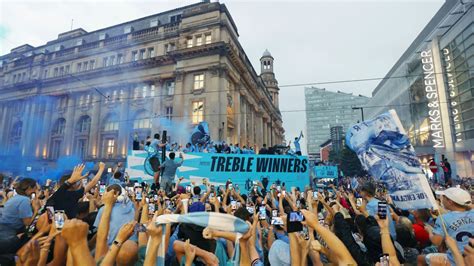 Man City celebrate historic treble with a parade in the rain - ESPN