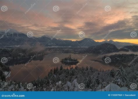 Winter Sunrise at Bled Lake with Snow on the Trees Stock Image - Image of bell, reflection ...