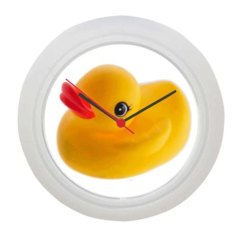 a yellow rubber ducky clock with black eyes in a white circular frame ...