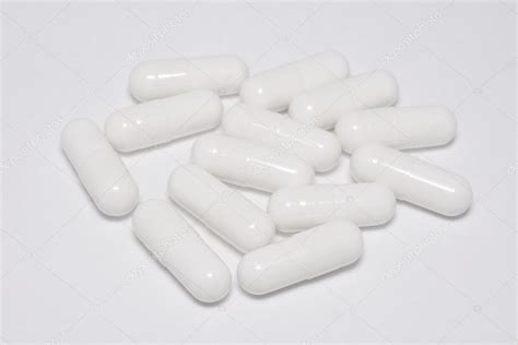 White capsule pills on white Stock Photo by ©pockygallery 96587282