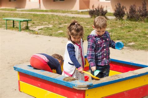 Playing in the sandbox stock image. Image of little, preschool - 54884447