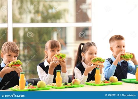 Happy Children Eating Healthy Food for Lunch Stock Photo - Image of ...