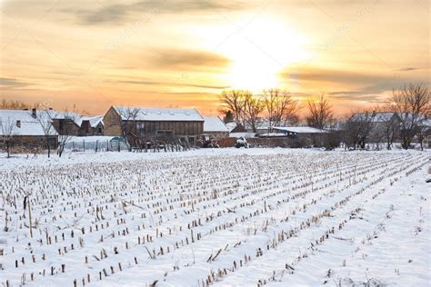 Winter landscape with snowy countryside village next to cornfiel Stock Photo by ©feelphotoartz ...