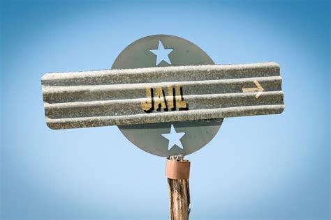 Street Sign to Jail stock image. Image of arrest, street - 144981629