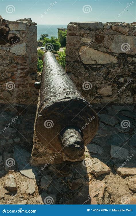 Old Iron Cannon Aiming through Crenel in Wall at the Marvao Castle ...