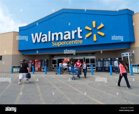 Exterior view of Walmart Supercentre Store and people with shopping ...