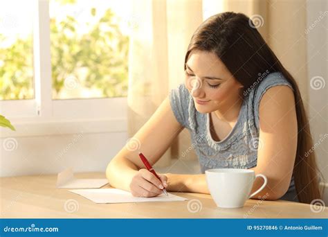 Girl Writing a Letter on a Table Stock Photo - Image of hand, filling: 95270846