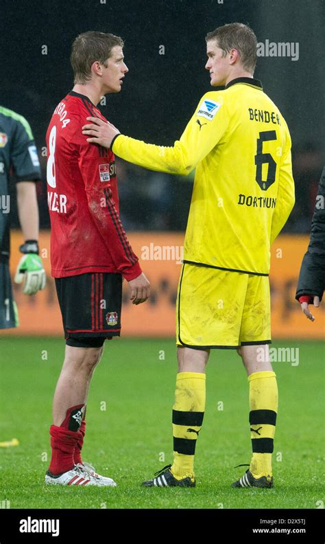 Dortmund's Sven Bender (R) and his twin Leverkusen's Lars Bender chat ...