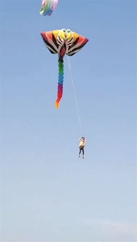 Wild video shows thrill-seeker using kite to soar up to 100 feet in the air