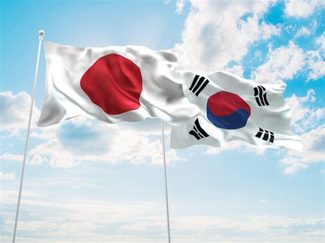 3D illustration of Japan & South Korea Flags are waving in the sky ...