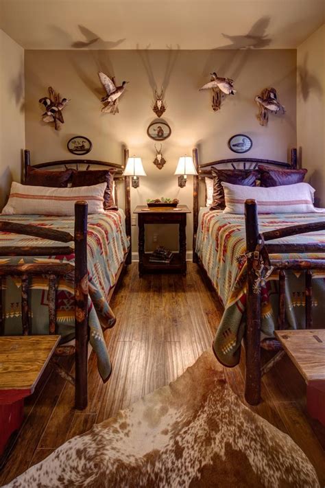 Lodge-Style Bedroom Boasts Mounted Birds and Log Beds | Lodge style bedroom, Lodge bedroom ...