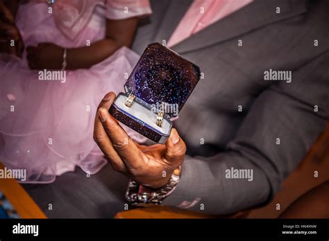 Groom showing the wedding rings during ceremony Stock Photo - Alamy