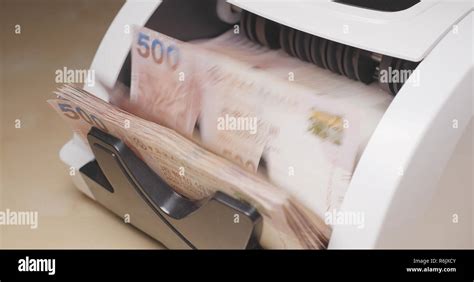 Money counting machine Stock Photo - Alamy