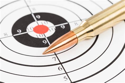 Rifle bullet over target background 7039378 Stock Photo at Vecteezy