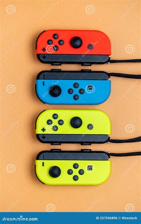 Nintendo Switch Joy-Cons Aligned in a Row. Yellow Blue and Red Joy-Cons Top View. Editorial ...