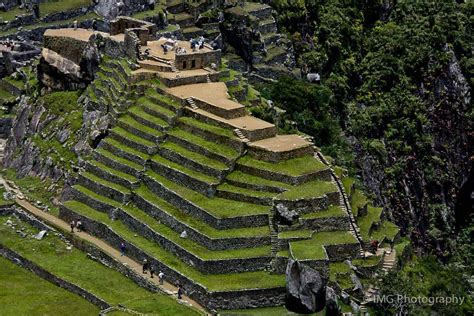 Another view of the pyramid-like outcrop that holds the Intihuatana (sacred stone) at Machu ...