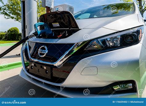 New 2018 Nissan Leaf Electric Car Plugged in To Charge Battery at the ...