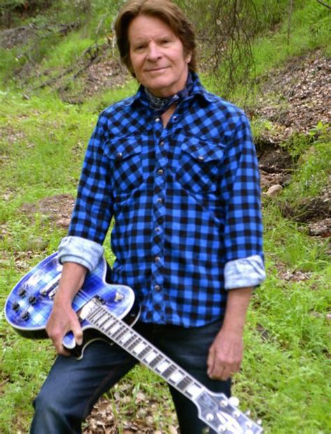 John Fogerty with one of his many guitars... he has a massive collection.