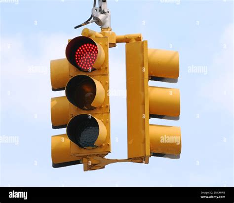 hanging traffic light against a daylight sky background Stock Photo - Alamy