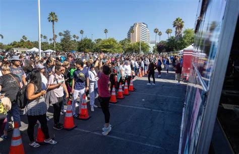 Taylor Swift merch: Eras Tour fans line up to buy Swift shirts and more