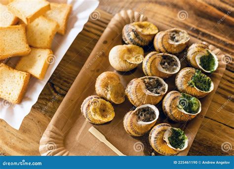 Helix Aspersa Muller, Maxima Snail. Edible Snails with Butter and Seasonings. Stock Photo ...