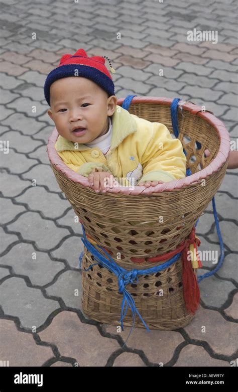 Baby in basket carrier Sichuan China Stock Photo - Alamy