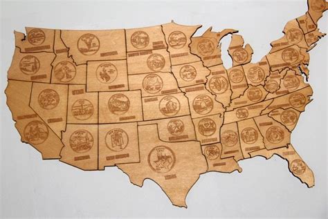 Magnetic puzzle map of the USA, laser engraved into the wood and decorated with the quarter ...