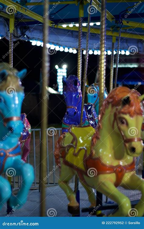 Horses on Carousel Merry Go Round at Carnival in Nighttime Stock Photo ...