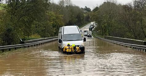 A38 flooding causes huge delays as cars left stranded in water at ...