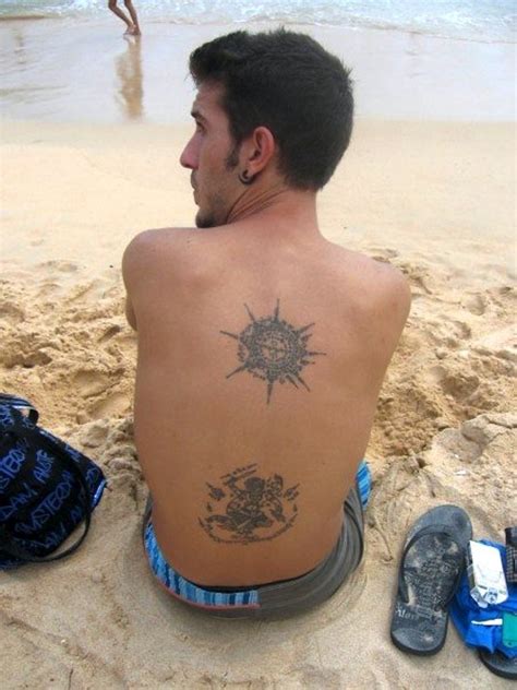 buddhist monk tattoo - i like the idea of constructing the compass with letters/ words from ...