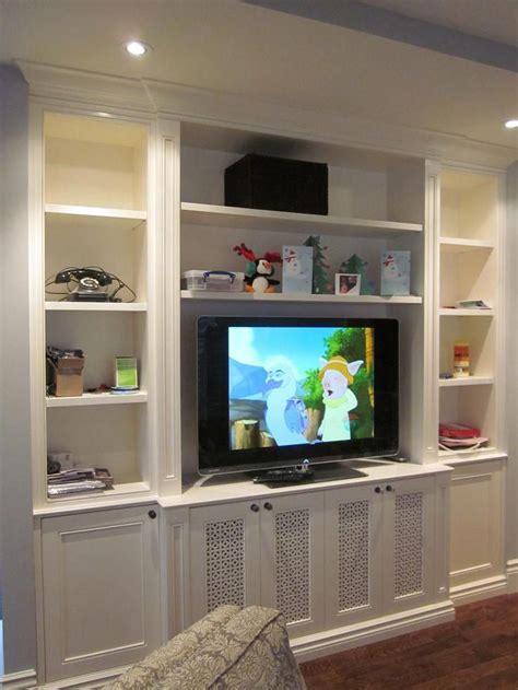 Decor that doesn't distract around the television. // I'd really like a big shelving unit-esque ...