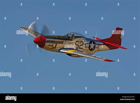 Airplane WWII vintage Red Tail P-51 Mustang fighter flying at California Air Show Stock Photo ...