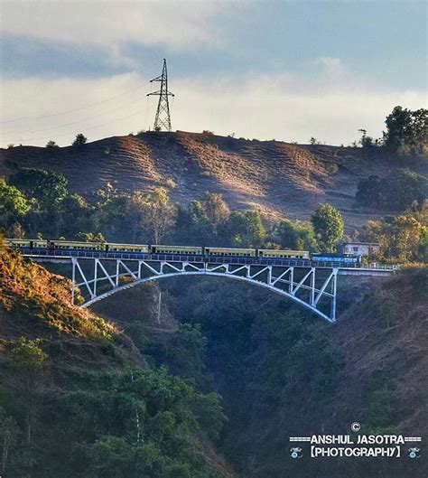 The Train A Train crossing the Bridge near Kangra. Travelling The narrow gauge railway track,the ...