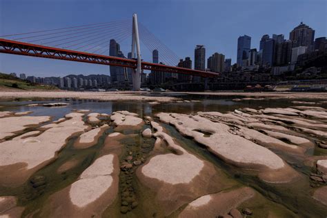 Yangtze tributary runs dry as China faces another month of drought ...