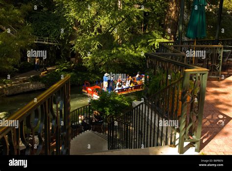 San Antonio River Walk riverwalk above tour boat with passengers passes ...