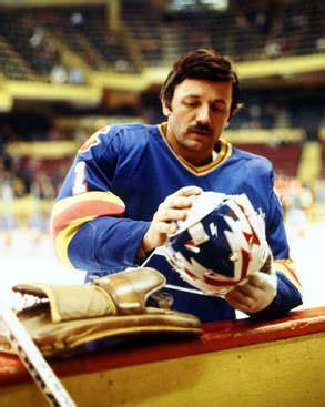 Chico Resch adjusts his mask for a Rockies game vs. the Bruins at Boston Garden. (Photo by Steve ...