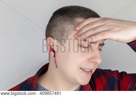 Man Whose Ear Bleeding Image & Photo (Free Trial) | Bigstock