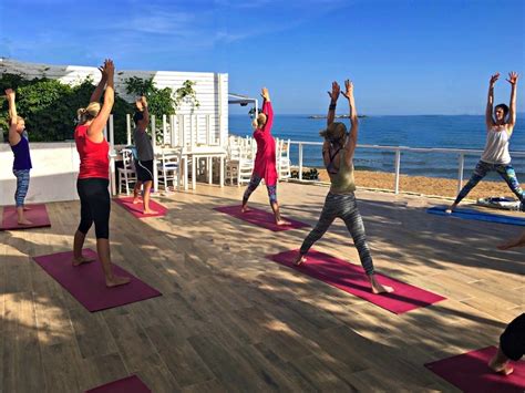 yoga class by the sea on a yoga retreat in crete - Yoga Escapes