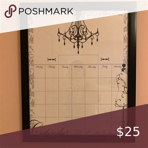 a white board with a chandelier hanging from it's side and the words poshmark below it