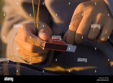 lighting a match Stock Photo - Alamy