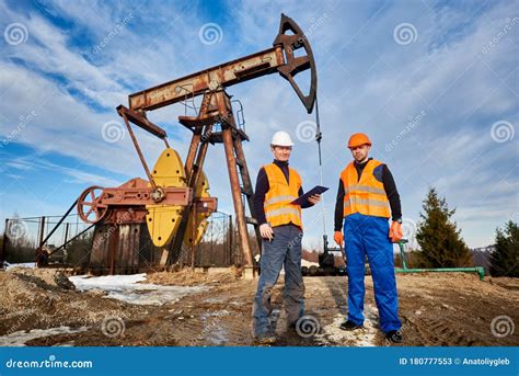 Oil Rig Workers Standing by Pump Jack. Stock Image - Image of friends ...