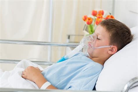 Sick Boy Wearing Oxygen Mask In Hospital Stock Photo - Image: 39217312