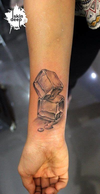 black ink ice cube tattoo on wrist – EntertainmentMesh