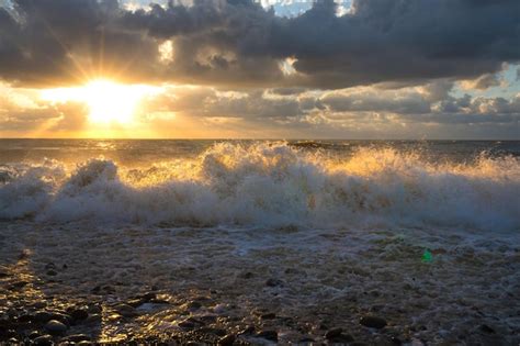 Premium Photo | A beautiful bright sunset on the black sea a wonderful beach sunset with clouds