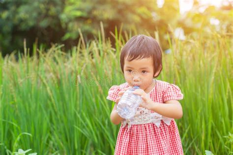 Lovely Little Girl Drinking Water Stock Photo - Image of hand, beautiful: 152419212